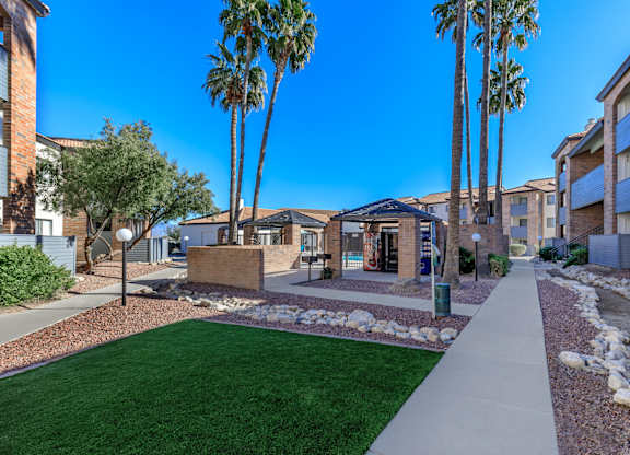 A sunny day in a residential area with a clear blue sky.