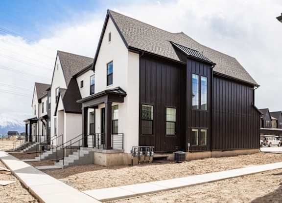 A modern house with a black and white exterior.