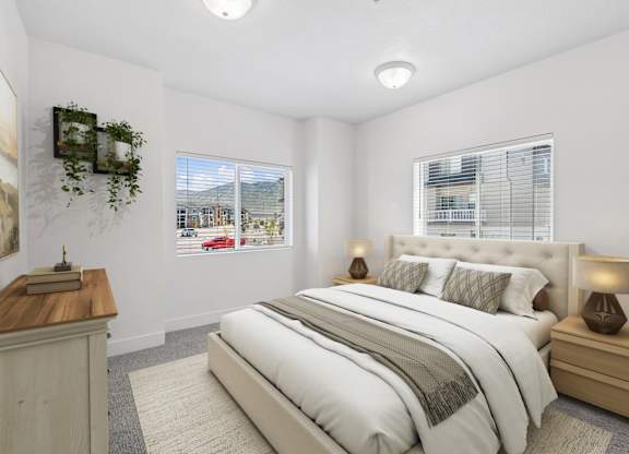 A bedroom with a large bed, a wooden nightstand, and a window with blinds.