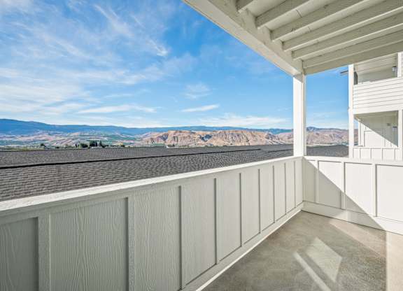 A balcony with a view of the mountains.