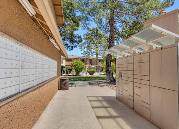 A long driveway leads to a house with a white garage door.