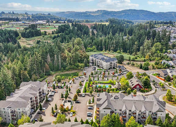 A bird's eye view of a residential area with houses and trees.