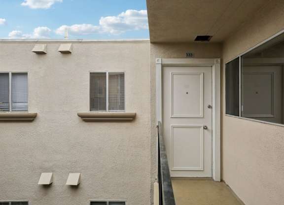 A white door is on the right side of the image.