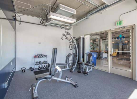 A gym with a variety of equipments at Herbert Residential, Arizona 85701