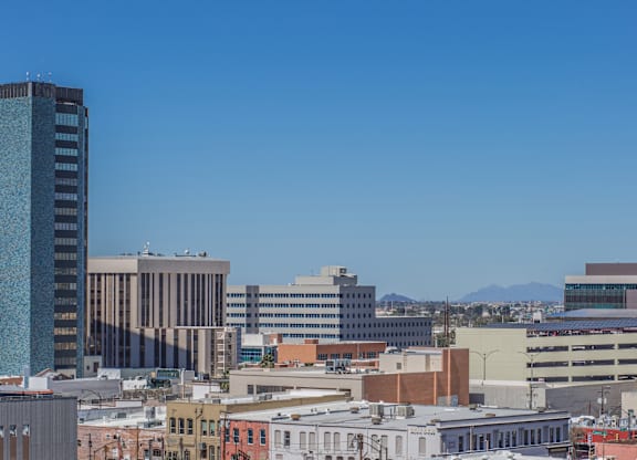A cityscape with a blue sky above at Herbert Residential, Tucson, AZ 85701