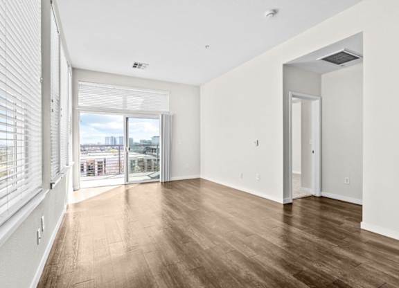 A room with wooden floors and white walls.