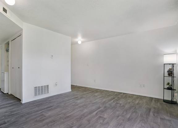 A room with a grey floor and white walls.