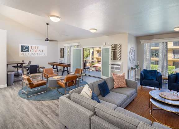 A living room with a grey couch and a coffee table.