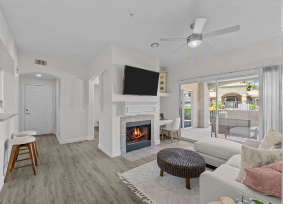 a living room with a fireplace and a television