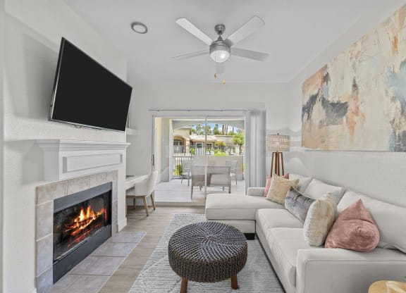 a living room with a fireplace and a tv