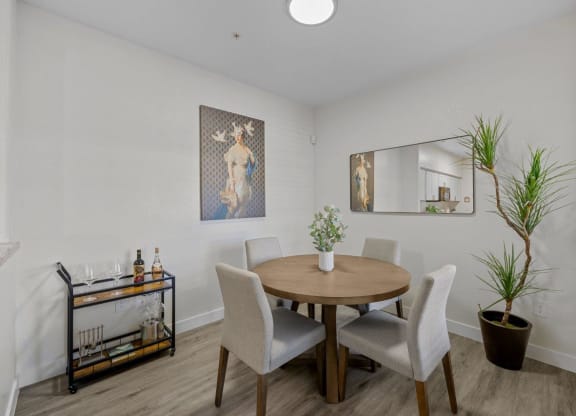 a dining room with a table and chairs