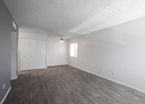A room with a white door and a window.