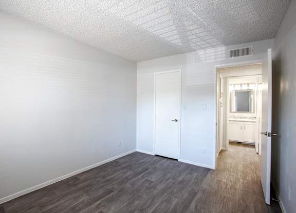 A room with a white door and a window.