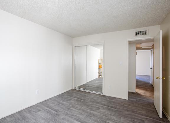 A room with a grey floor and white walls.