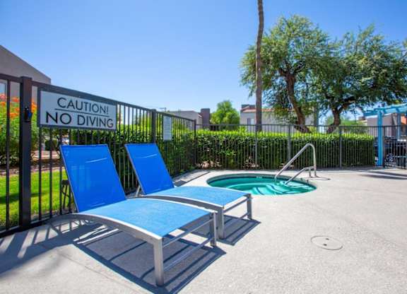 A pool area with a caution no diving sign.