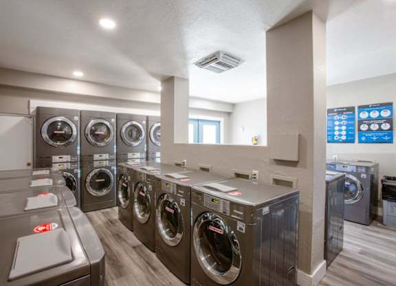 A row of washing machines in a public laundromat.
