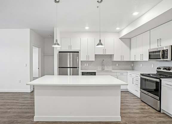 A modern kitchen with a large island in the center.