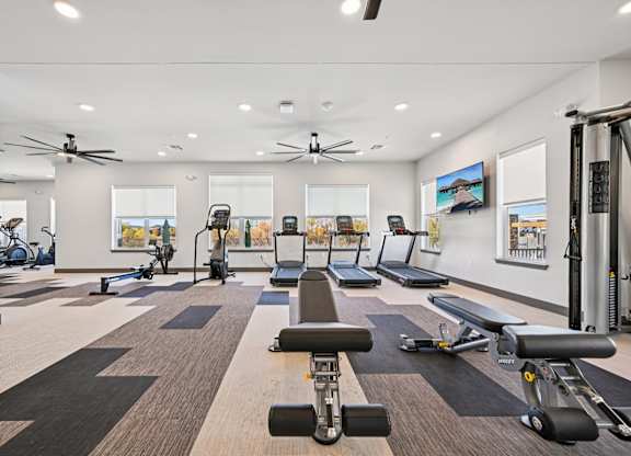 A spacious gym with a variety of exercise equipment.