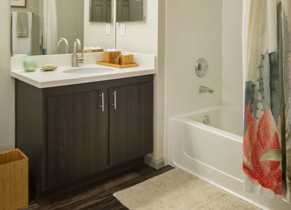 a bathroom with a bathtub and a sink