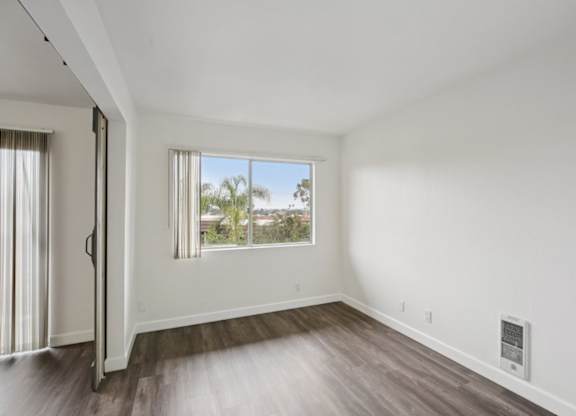 A room with a window and a door.