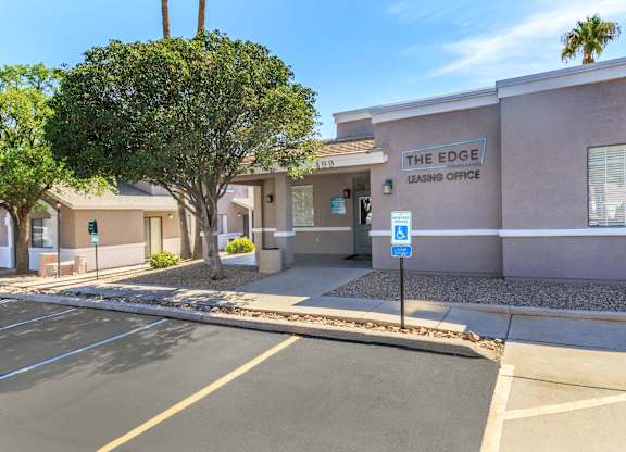 The Edge Leasing Office is located in a parking lot.