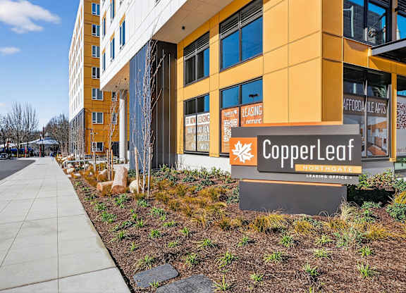 A building with a sign that says Copperleaf in front of it.