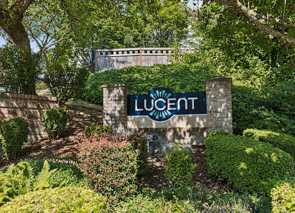 A sign that says Lucent in front of a building.