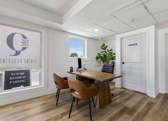 A room with a table and chairs and a sign that says "Future Resident Parking".