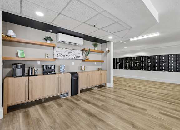 A coffee bar with wooden shelves and a blackboard menu.