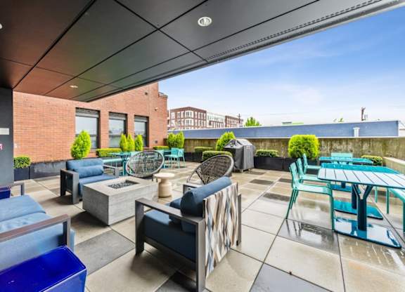 Outdoor terrace with fire pit at Grand Belmont Apartments in Central Eastside Portland, Oregon.
