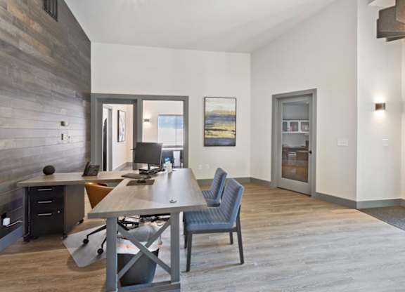 A modern office with a wooden desk and a chair.