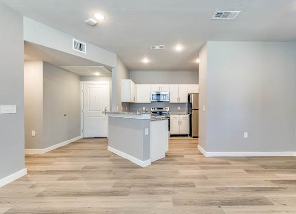 A kitchen with a white counter and cabinets at Four Cedars, Texas, 75058