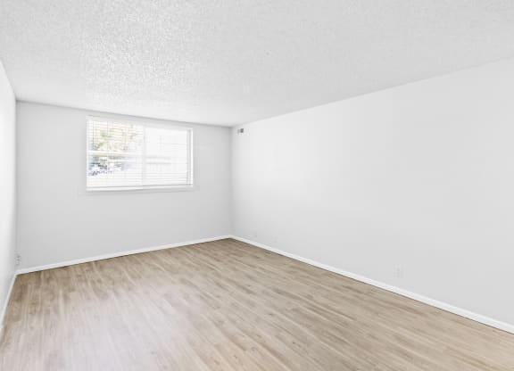 Proximity Apartment Homes Bedroom with Wood like floors