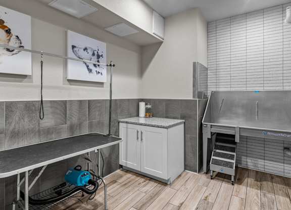 a utility room with stainless steel appliances and a sink at Alton Jefferson Park, Denver