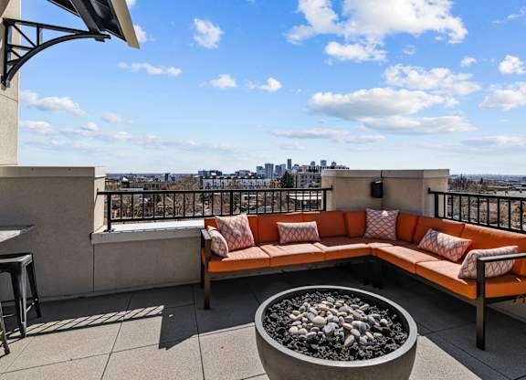 a rooftop patio with a couch and a fire pit at Alton Jefferson Park, Colorado, 80211