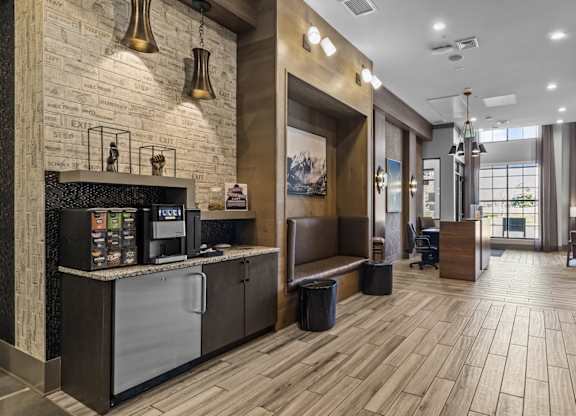 the lobby of a hotel with a reception desk and a coffee machine at Alton Jefferson Park, Colorado
