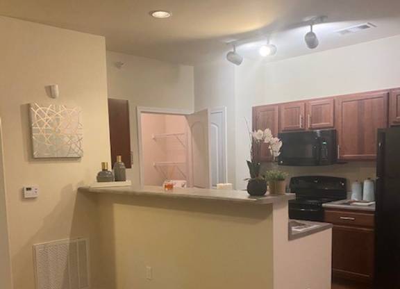 A white fluffy ball is hanging from the ceiling.