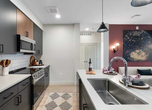 a kitchen with stainless steel appliances and a sink