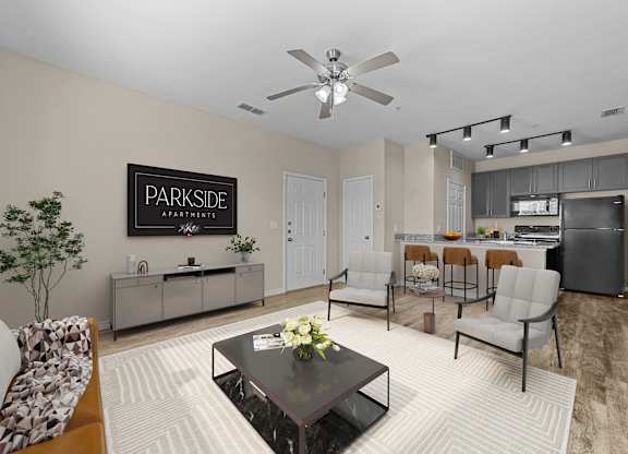 A living room with a Parkside Apartments sign on the wall.