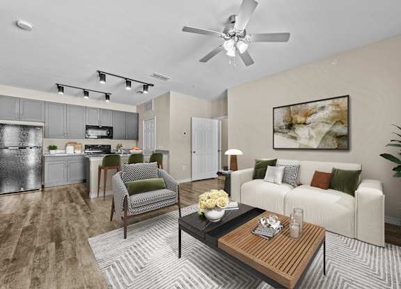 A modern living room with a white couch and a wooden coffee table.