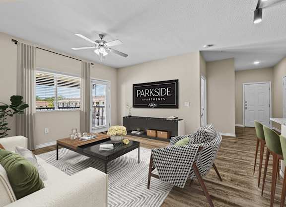 A living room with a sofa, chairs, and a coffee table.