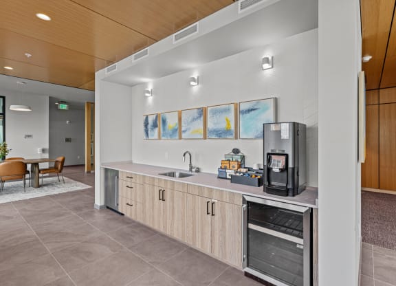 the preserve at ballantyne commons clubhouse kitchen with coffee machine and sink