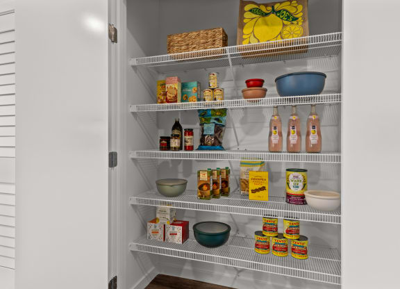 a refrigerator with shelves filled with food and drinks