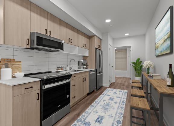 a kitchen with wooden cabinets and a stove and a microwave