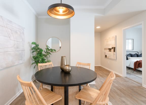 a dining room with a table and chairs