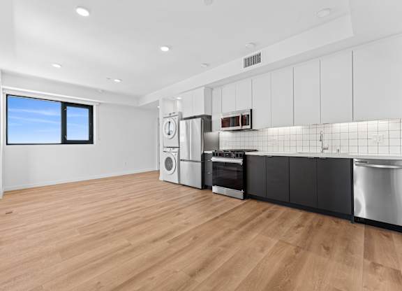 OnyxOnPark_SanDiego_CA_Vacant_2BR_B1_A kitchen with a washer and dryer built in.