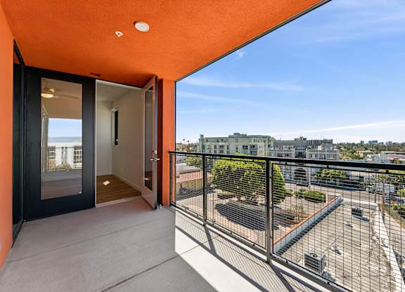 A balcony with a view of the cityscape.