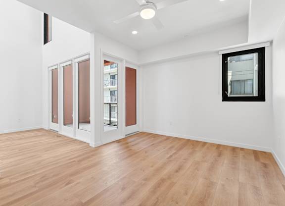 OnyxOnPark_SanDiego_CA_Vacant_Penthouse_A_A room with a wooden floor and a ceiling fan.