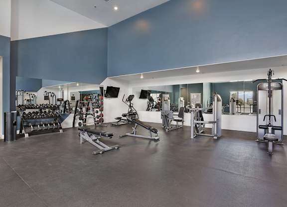 Alvera at the Meadows  gym with a variety of equipment including weights and machines.