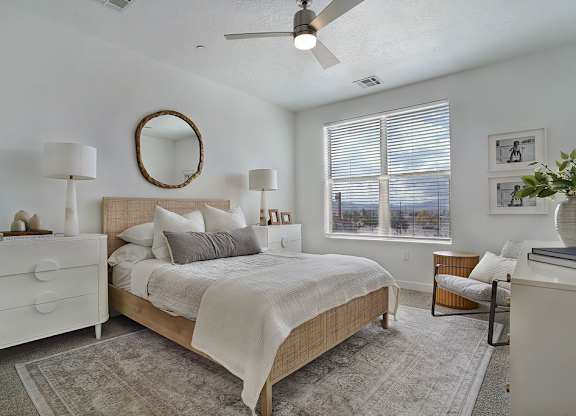 Alvera at the Meadows bedroom with a bed, dresser, and mirror.